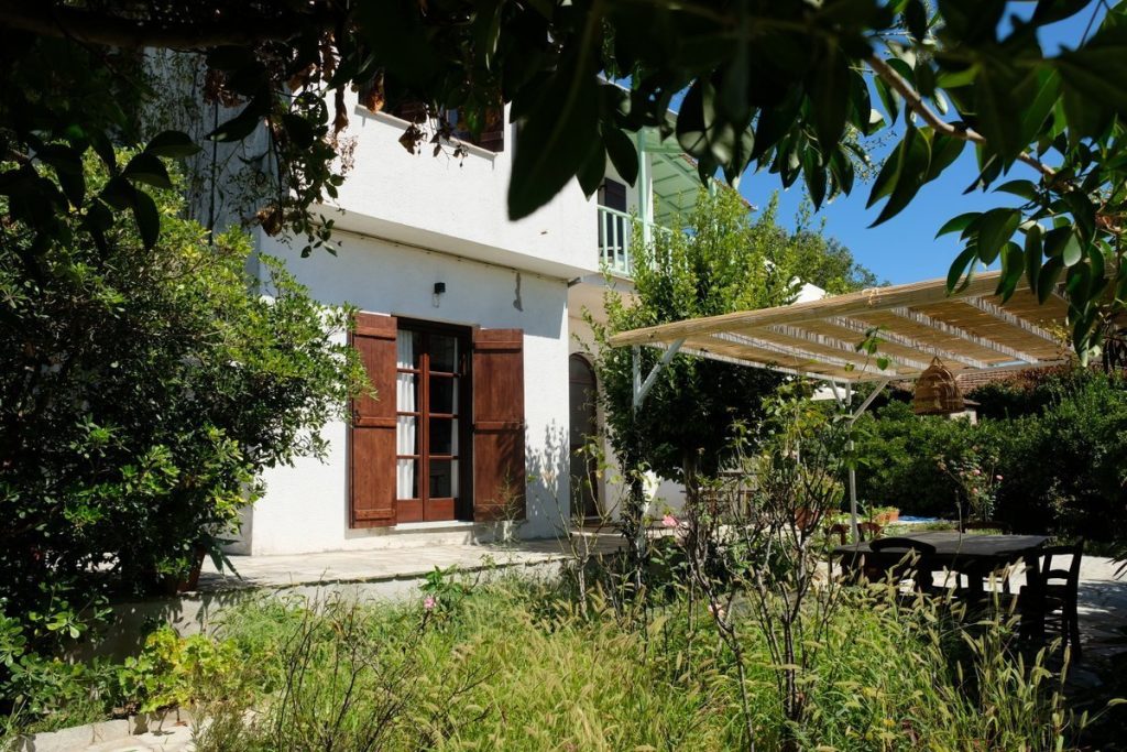 In front of the house. Modern cottage for rent in Lafkos. House to let. Vacation home in Pelion. Holidays in Greece.