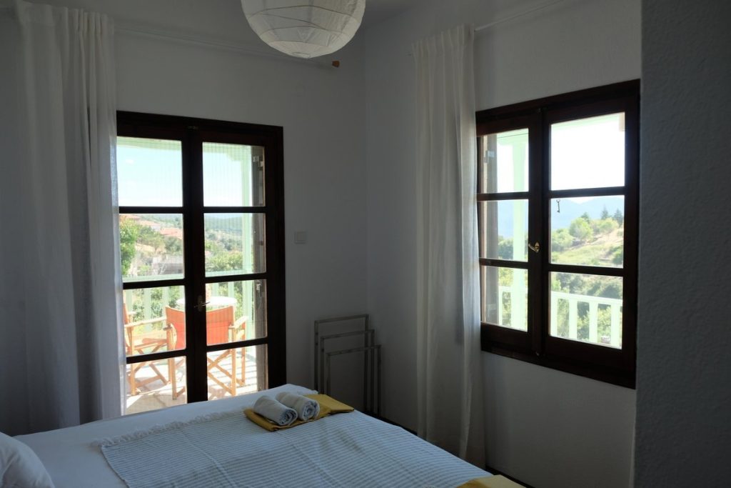 Amazing view from the sleeping room. Stay in a beautiful cottage overlooking the charming village of Lafkos and the nature of the South Pelion mountains.