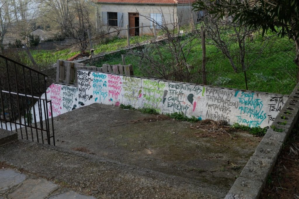 Wall with names of former students. The Village Lafkos is one of the most beautiful and authentic places on the Greek peninsula of Pelion, characterized by an atmospheric square and the absence of cars. Vacation home in Pelion. Holidays in Greece.